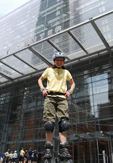 Me, standing tall, in rollerblades and a helmet in the Spring of 2009.