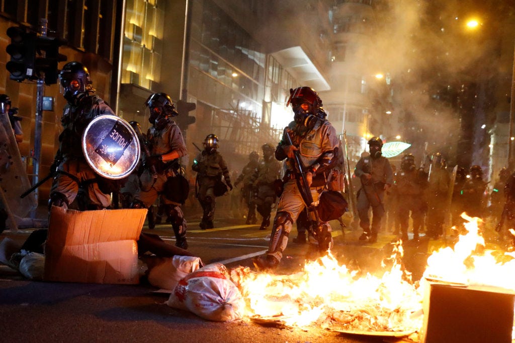Hong Kong chaos sees tear gas, attack on Chinese news agency | PBS News  Weekend