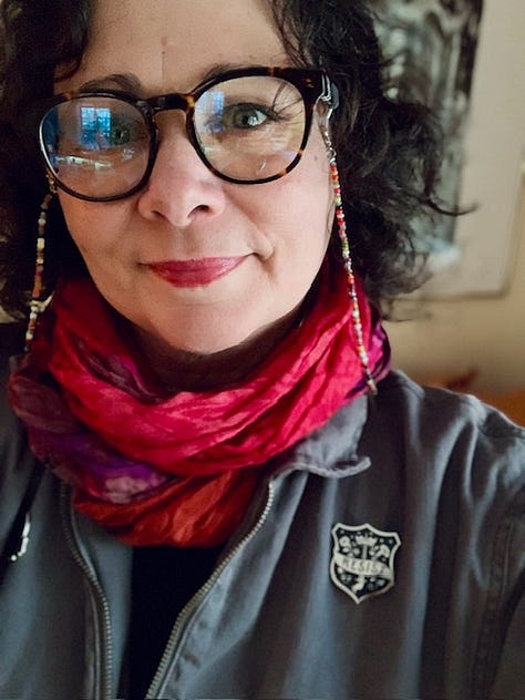 three photos - one of three poets at a table with typewriters, one of a cloth heart with the word "poet" stitched on it, one of a dark-haried woman with classes wearing a pin that says "resist"