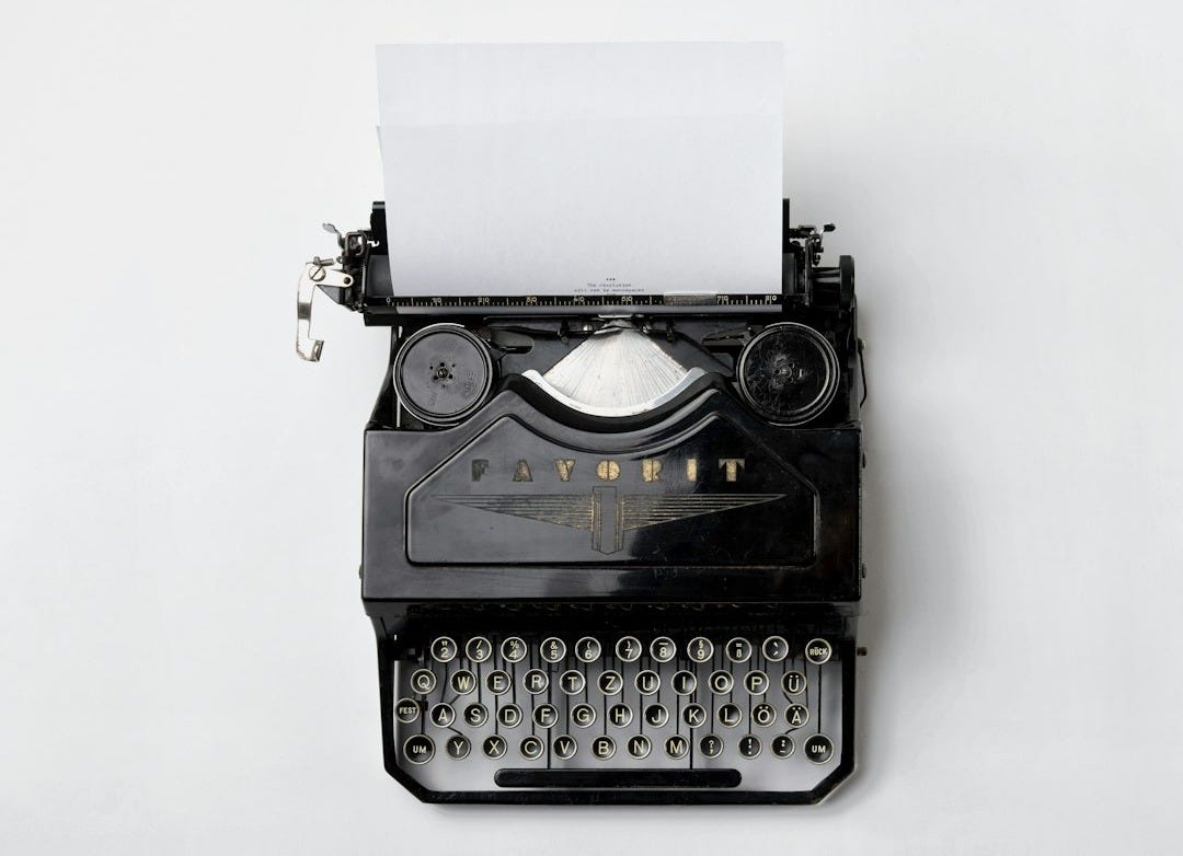 black Fayorit typewriter with printer paper black Fayorit typewriter with printer paper