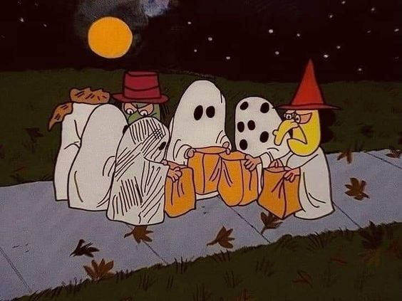 This may contain: three cartoon characters dressed in halloween costumes sitting on a sidewalk at night with the moon behind them