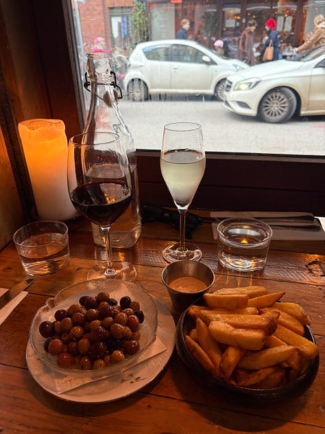 A plate of grilled cheese, plates on a restaurant table