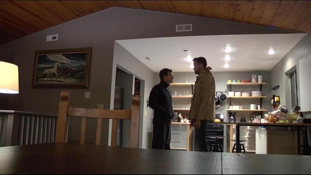 a screen from the movie Creep featuring Mark Duplass and Patrick Brice facing each other in a kitchen