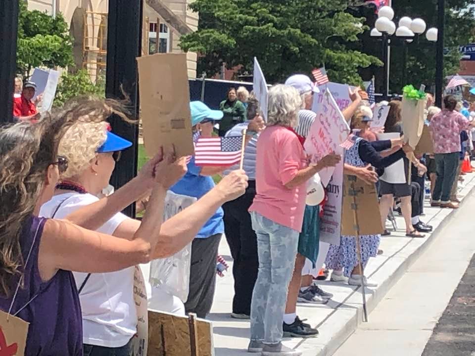 May be an image of 7 people, crowd and text