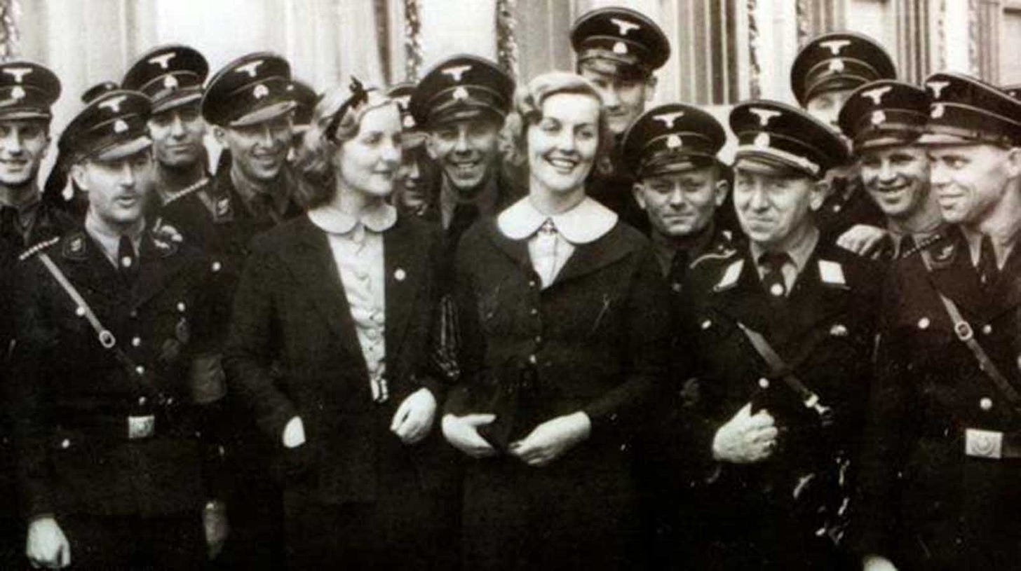 Unity Mitford (left) and her sister Lady Diana Mosley (right), née Mitford, pictured with SS troops at the September 1937 Nuremberg Party rally. The sisters were well-known figures in pre-war Germany, openly sympathetic to the Nazi regime. Unity Mitford (left) and her sister Lady Diana Mosley (right), née Mitford, pictured with SS troops at the September 1937 Nuremberg Party rally. The sisters were well-known figures in pre-war Germany, openly sympathetic to the Nazi regime.