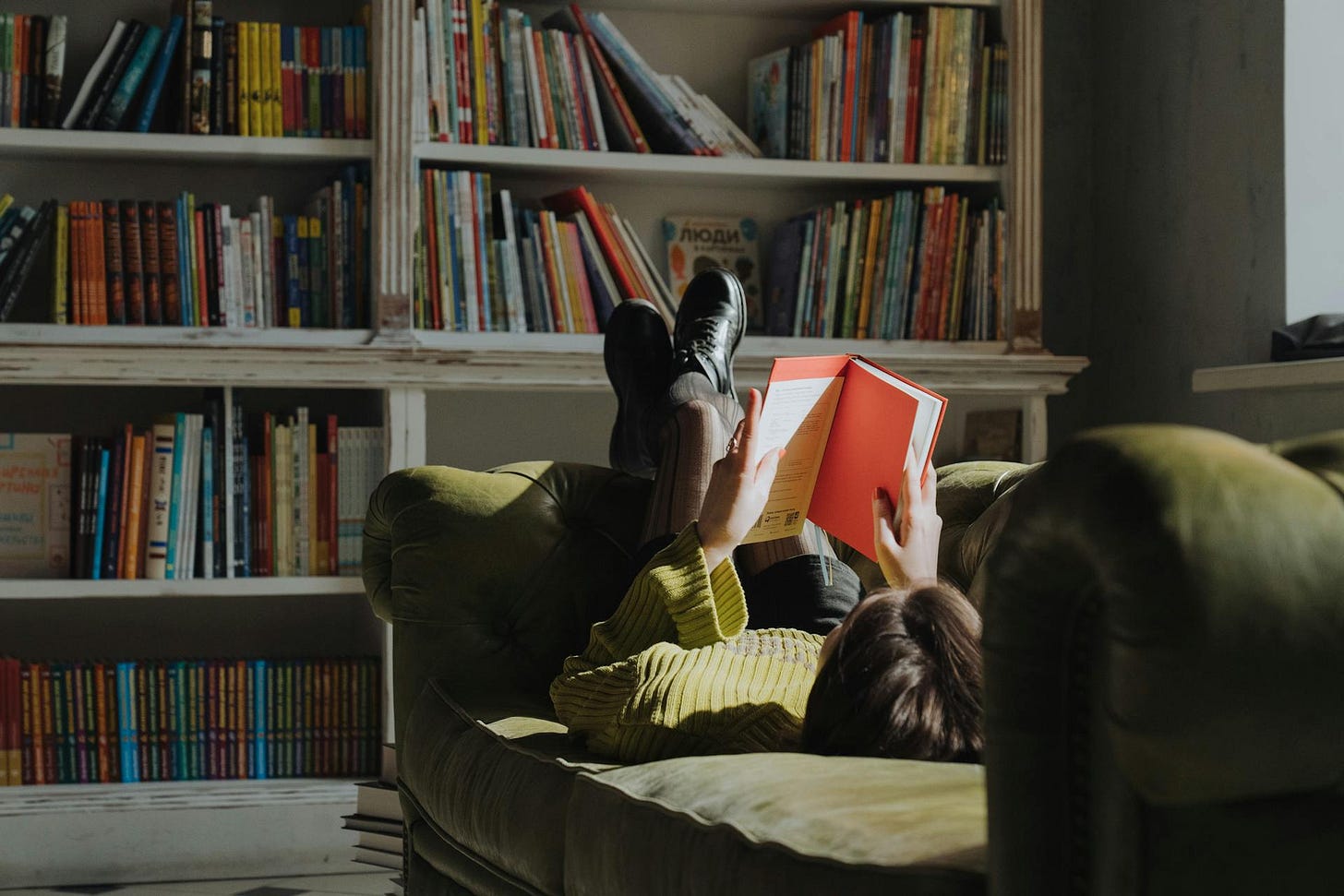 Woman reading on couch Woman reading on couch
