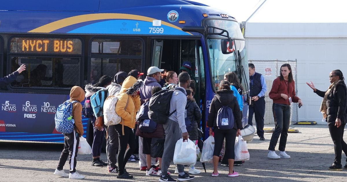 Illegal immigrants arrive at Floyd Bennett Field in Brooklyn, New York, on Sunday.