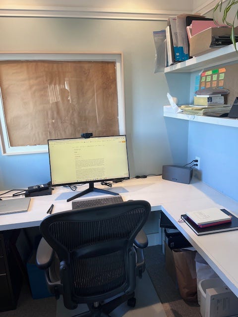 A clean desk top in a small office.