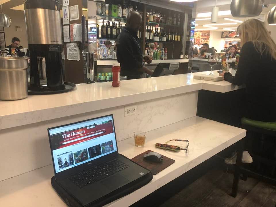 May be an image of 2 people, drink and text