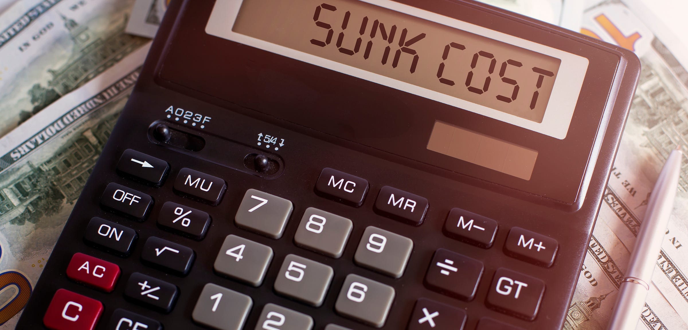 A calculator displays "sunk cost" A calculator displays "sunk cost"