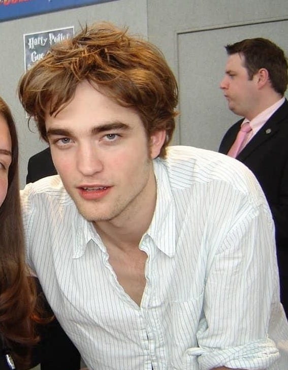 This may contain: two people are posing for the camera at an event