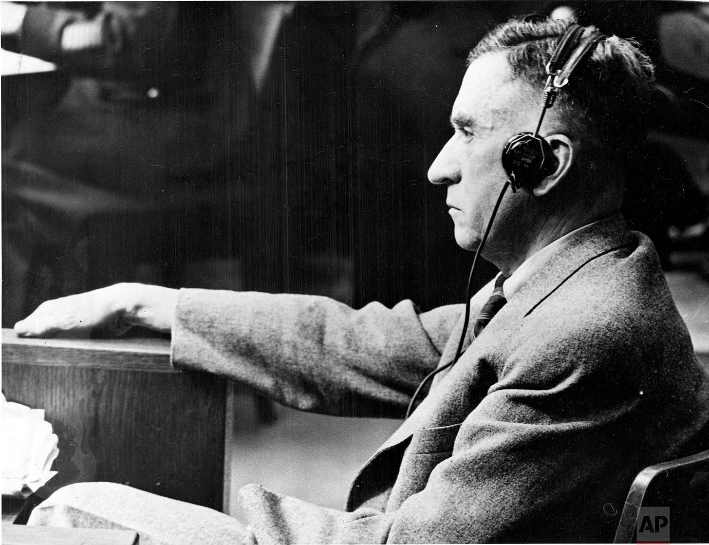Carl Krauch, main defendant of Case 6 and former chairman of I.G. Farben Chemical Industries, takes the stand to testify in his own defense at the U.S. Military Tribunal in Nuremberg on January 13, 1948, during the subsequent trials. Carl Krauch, main defendant of Case 6 and former chairman of I.G. Farben Chemical Industries, takes the stand to testify in his own defense at the U.S. Military Tribunal in Nuremberg on January 13, 1948, during the subsequent trials.