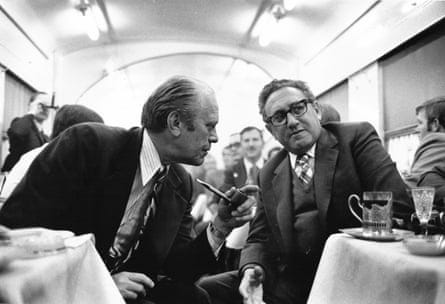 two men speak with each other in a train two men speak with each other in a train