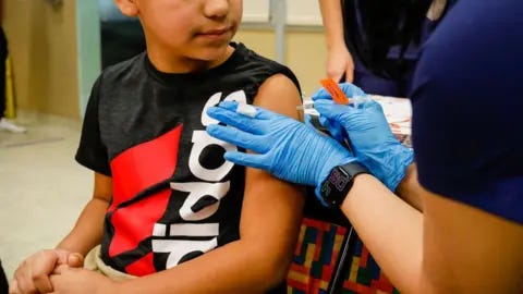 Getty Images A child seen receiving a vaccine in 2021. 