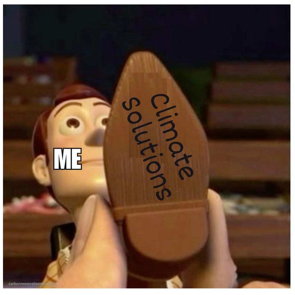 A close-up of Woody from Toy Story, eyes wide, labeled "ME", with a hand pressing the sole of a boot flat against his face. The sole is labeled "Climate Solutions" in curved handwriting.