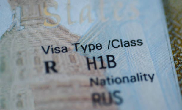 Fragment of H1B visa (for specialty workers) stamp in passport, blurred april calendar on background. H1B visa program deadline concept. Close up view. Fragment of H1B visa (for specialty workers) stamp in passport, blurred april calendar on background. H1B visa program deadline concept. Close up view. h-1b stock pictures, royalty-free photos & images Fragment of H1B visa (for specialty workers) stamp in passport, blurred april calendar on background. H1B visa program deadline concept. Close up view. Fragment of H1B visa (for specialty workers) stamp in passport, blurred april calendar on background. H1B visa program deadline concept. Close up view. h-1b stock pictures, royalty-free photos & images