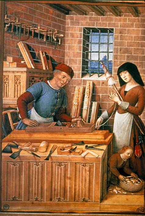 Medieval household workshops showing men and women working together in shared domestic and craft labor before industrialization.