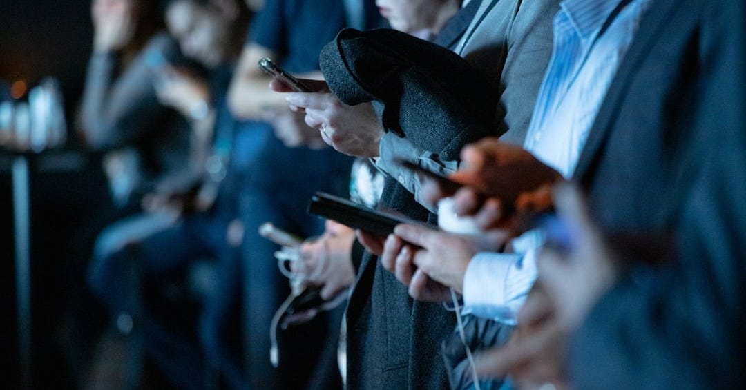 people using phone while standing people using phone while standing