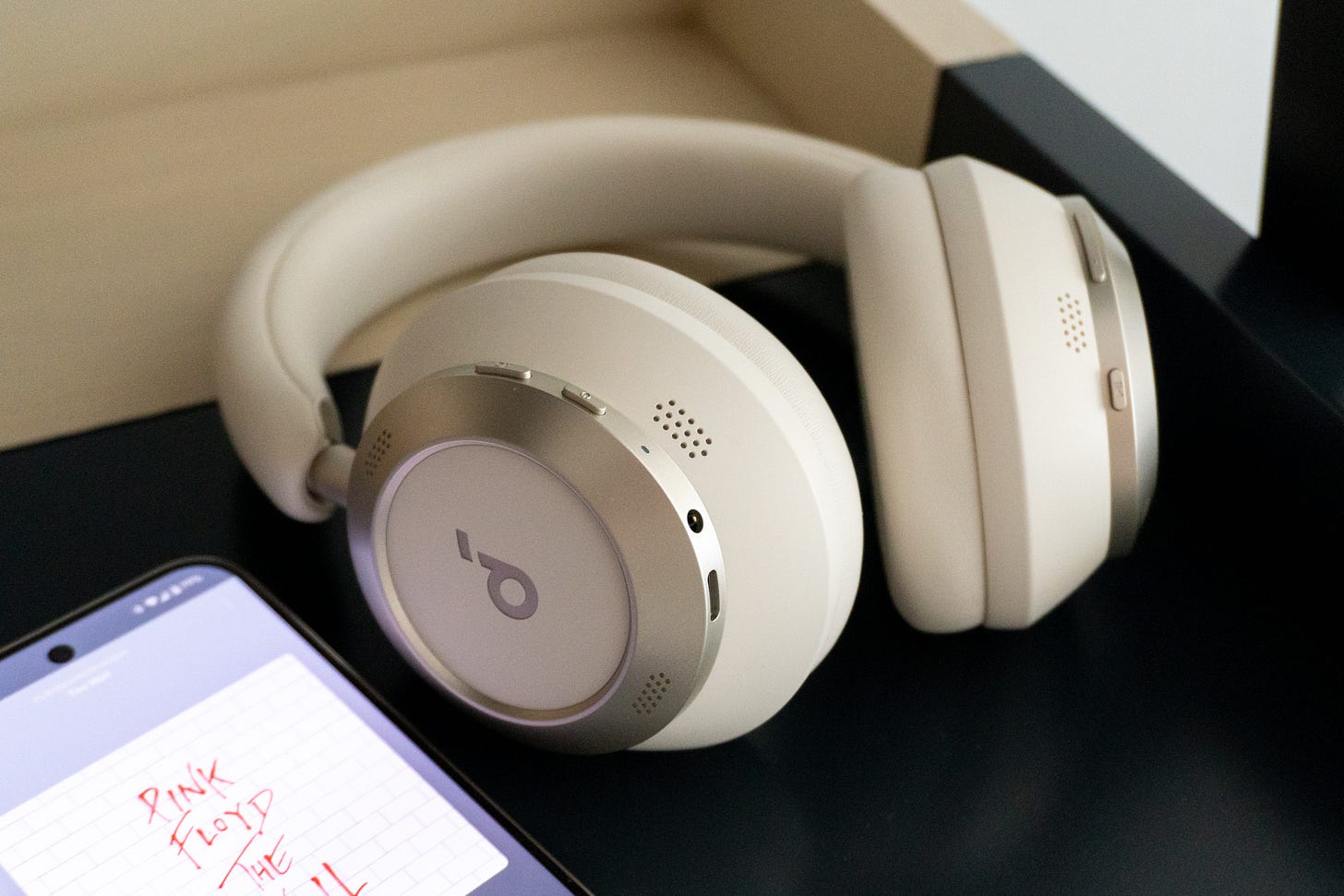 Anker Soundcore Space One Pro playing music on desk Anker Soundcore Space One Pro playing music on desk