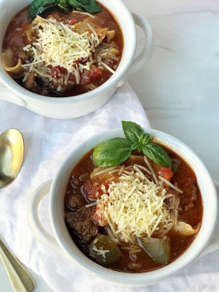 Soft pumpkin energy balls with oats and chocolate chips on white plate.
