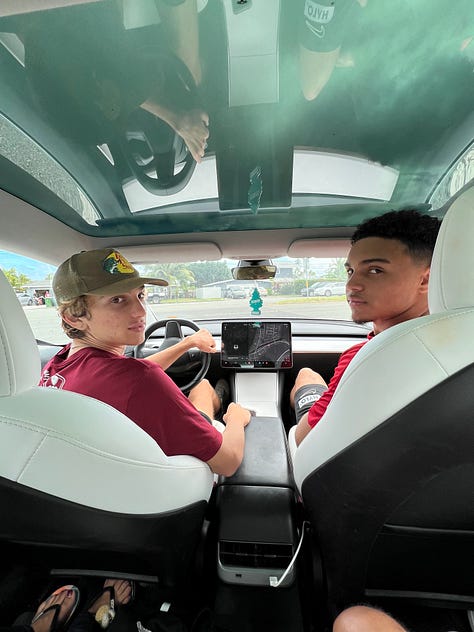 Three photos showing the growth of two best friends over the years — as young boys holding Pomeranian puppies, as teenagers sitting in a car, and as young men posing together at a piercing company. From little kids with fluffy dogs to full-on grown humans.