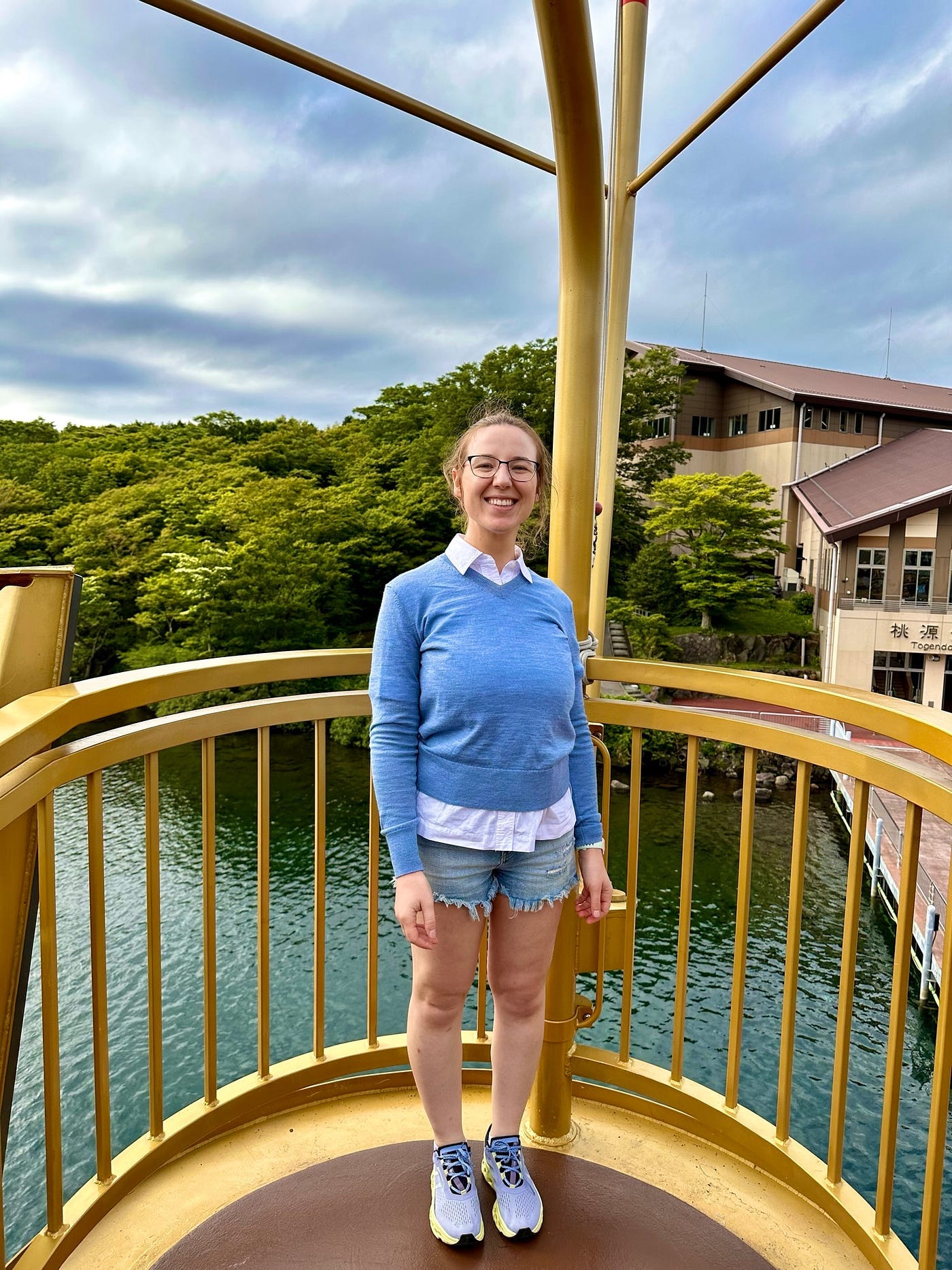 Mari-Alina Timoshchuk on a pirate ship in a blue sweater