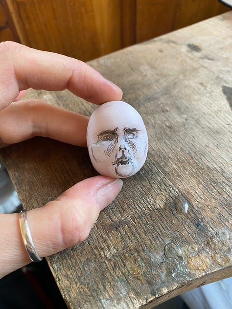 man carved out of pink opal