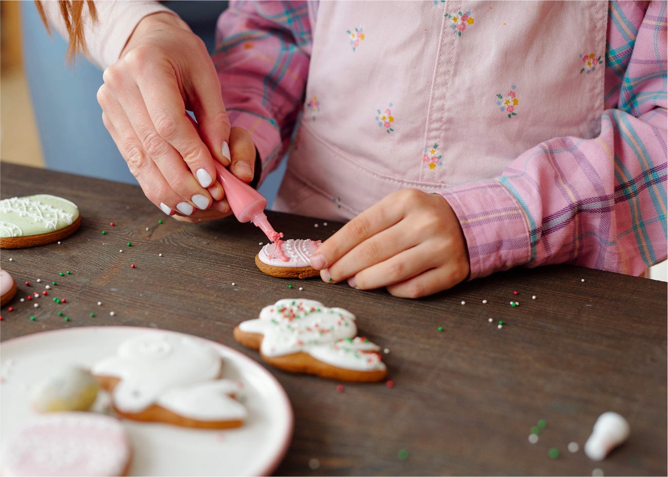 parent and child decorating cookies