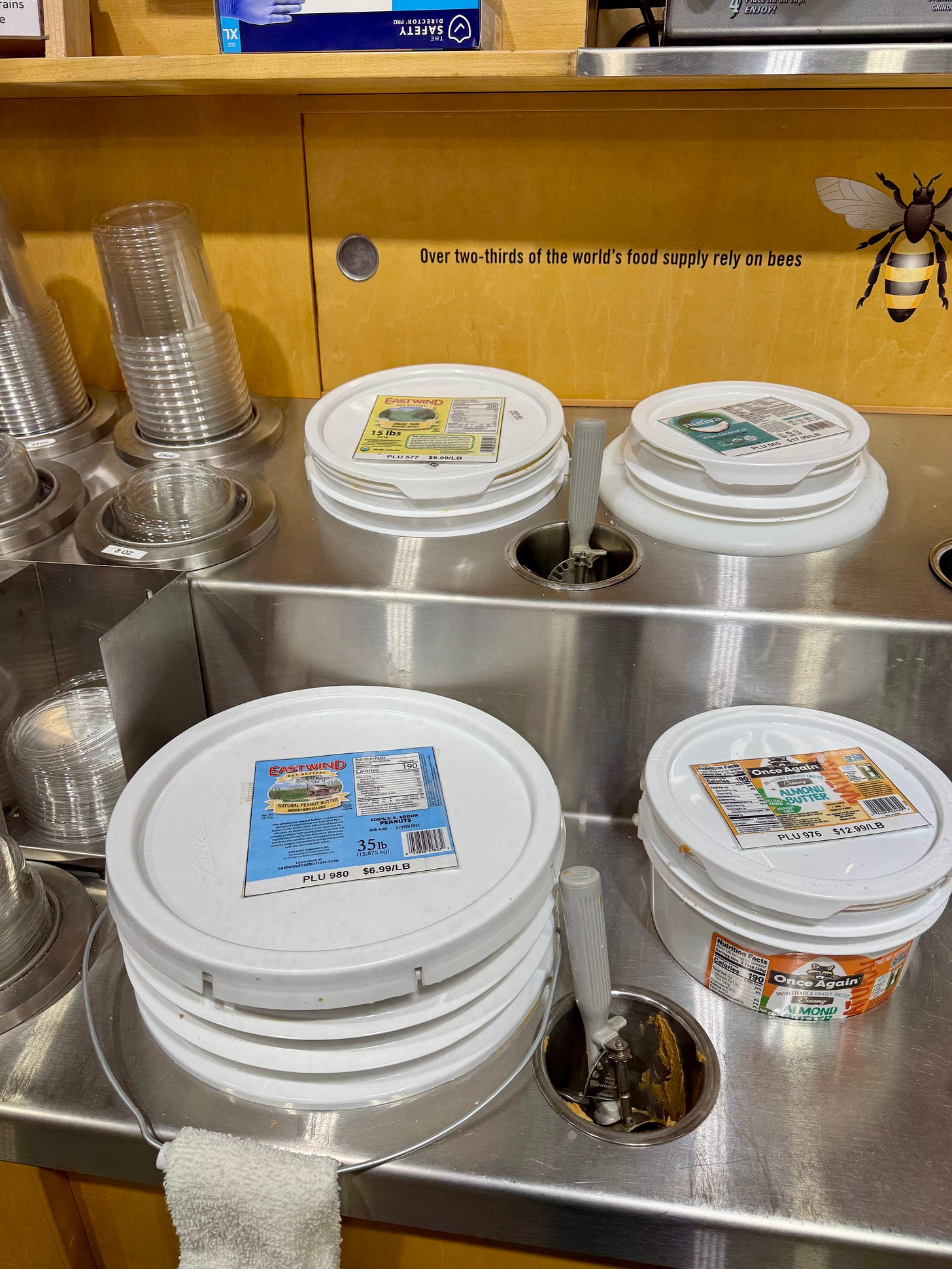 Tubs of peanut butter at a Michigan co-op