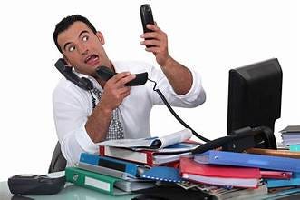 A person holding two phones

Description automatically generated
