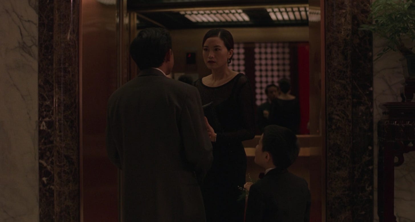 Sherry walks out of a hotel elevator to come face-to-face with NJ in Edward Yang's movie Yi Yi. 