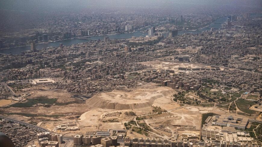 This picture taken on May 14, 2021, shows an aerial view of Egypt's capital Cairo's Nile island of Manial al-Roda (top) and the historic old Cairo district (bottom).