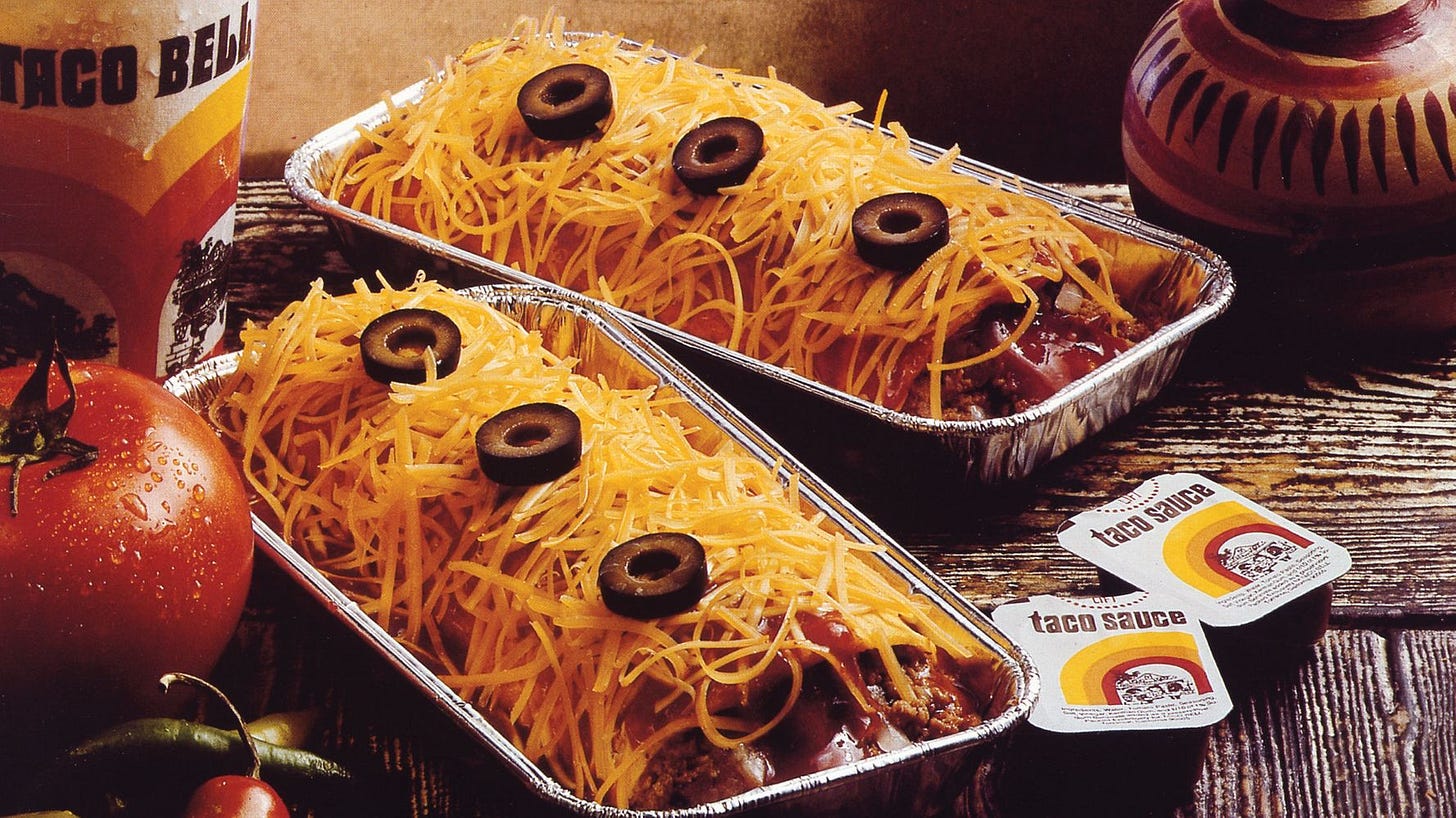 A vintage Taco Bell advertisement for the original enchirito - note the olives and the aluminum trays!