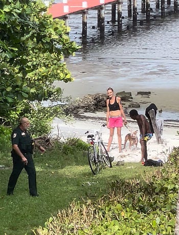 Palm Beach County Sheriff's deputy talks to right-of-way visitors. (LORRIE LAROSE) 