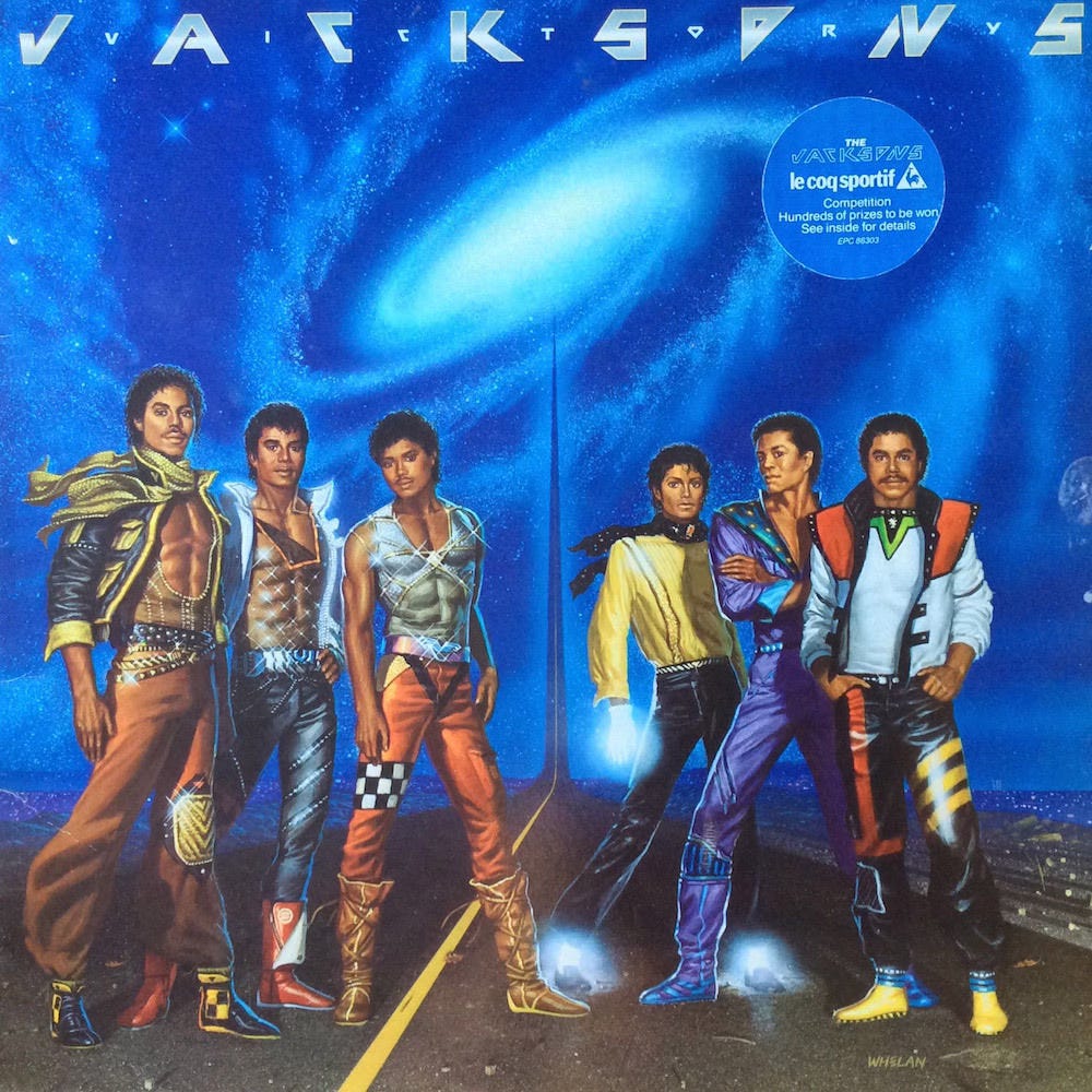 Album cover for VICTORY featuring the six Jackson brothers standing on a blacktop road with a single, solid yellow stripe running its distance. At the horizon, the road shoots into the sky and disappears into a spiral galaxy set against and electric blue night sky.