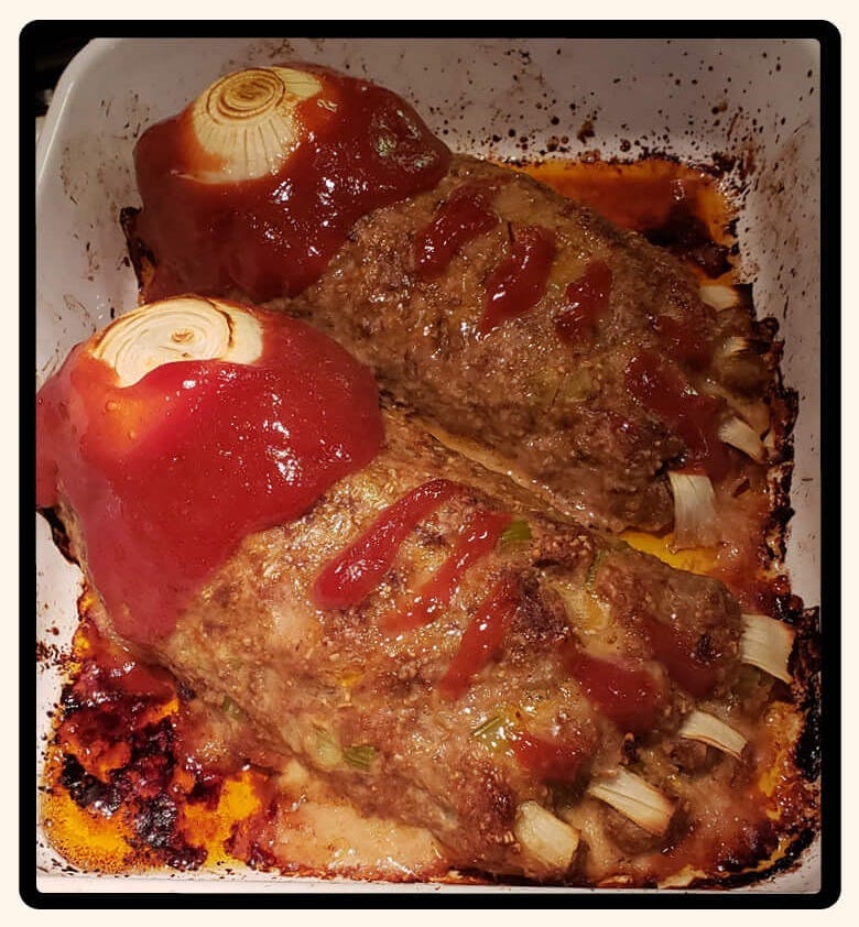 two cooked meatloaf loaves in the shape of feet