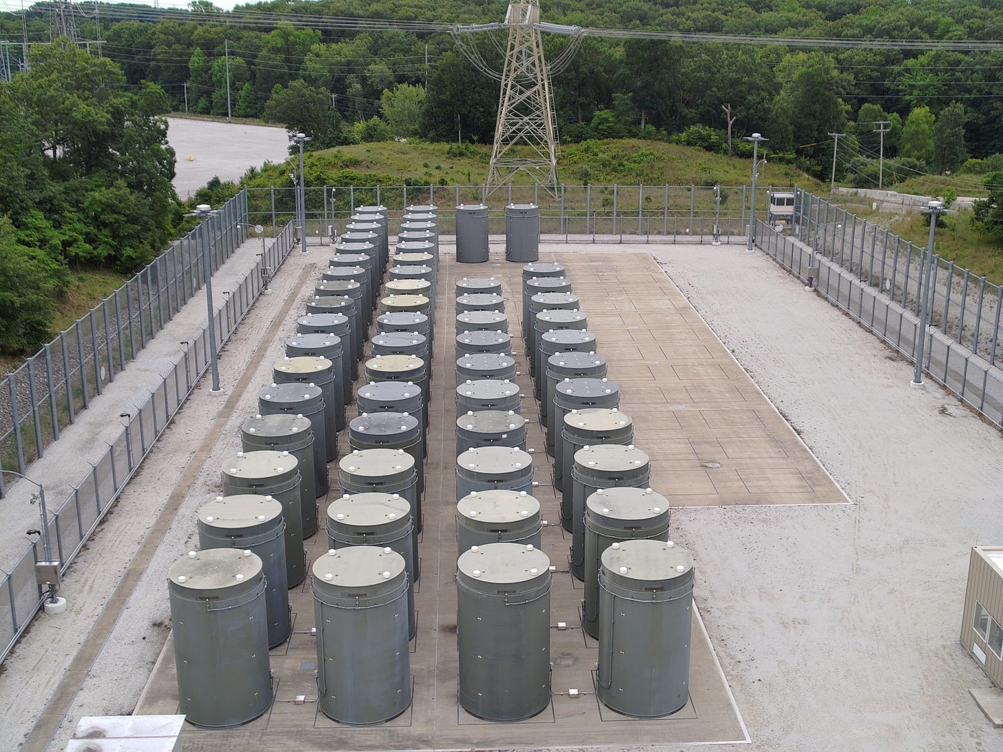 Dry cask waste storage containers at the Donald C. Cook Nuclear Plant in Bridgman, Mich. The concrete and steel casks contain spent nuclear fuel from the two plant reactors. The spent fuel rods are periodically moved from a pool inside the plant to these outdoor containers once they have sufficiently cooled. (Courtesy | American Electric Power)