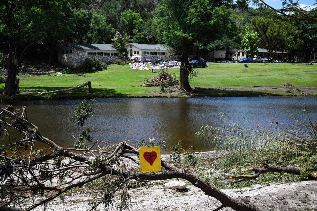 A painted broken heart is seen near Camp Mystic along the Guadalupe River in Hunt, Texas, on July 8, 2025, after severe flash flooding over the July 4 holiday weekend. 