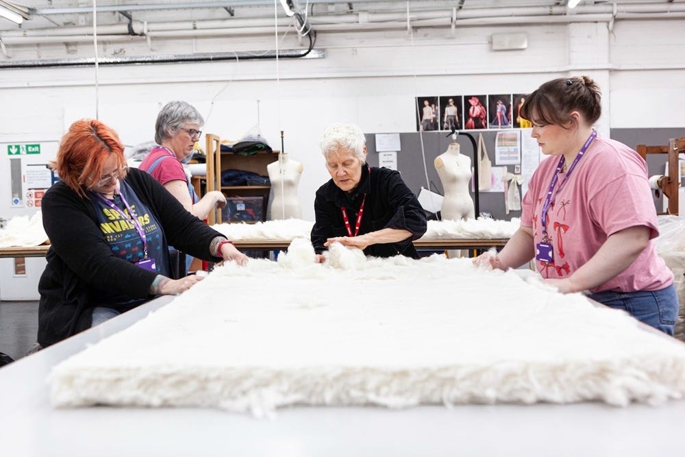 Ann Hamilton works with students for an art installation displaed at Salts Mill, West Yorkshire.