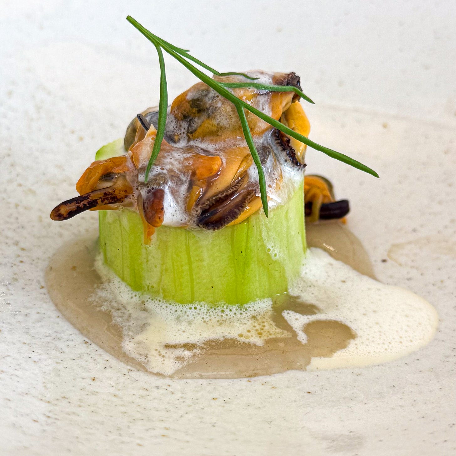 Squash steamed in a fig leaf, topped with mussels and a light foam at Bittikesu, Paris 4th Squash steamed in a fig leaf, topped with mussels and a light foam at Bittikesu, Paris 4th
