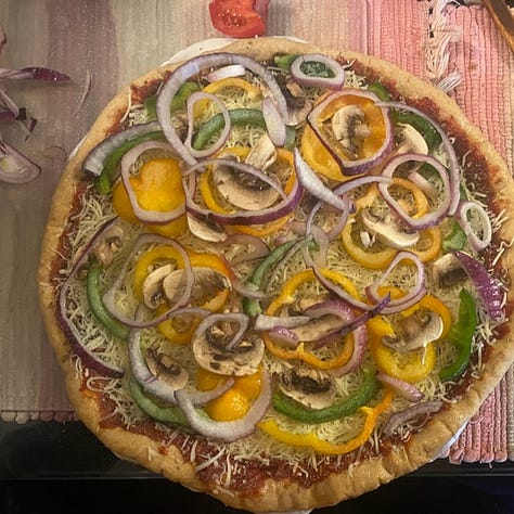 Homemade Pizza with wholewheat crust in three stages of the making.
