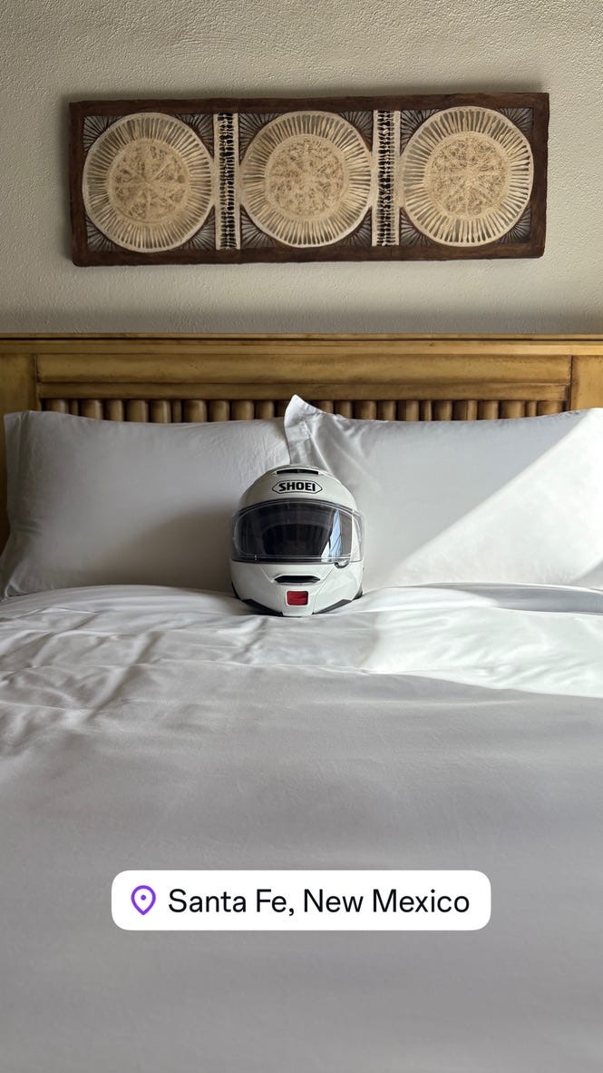 motorcycle helmet on a bed