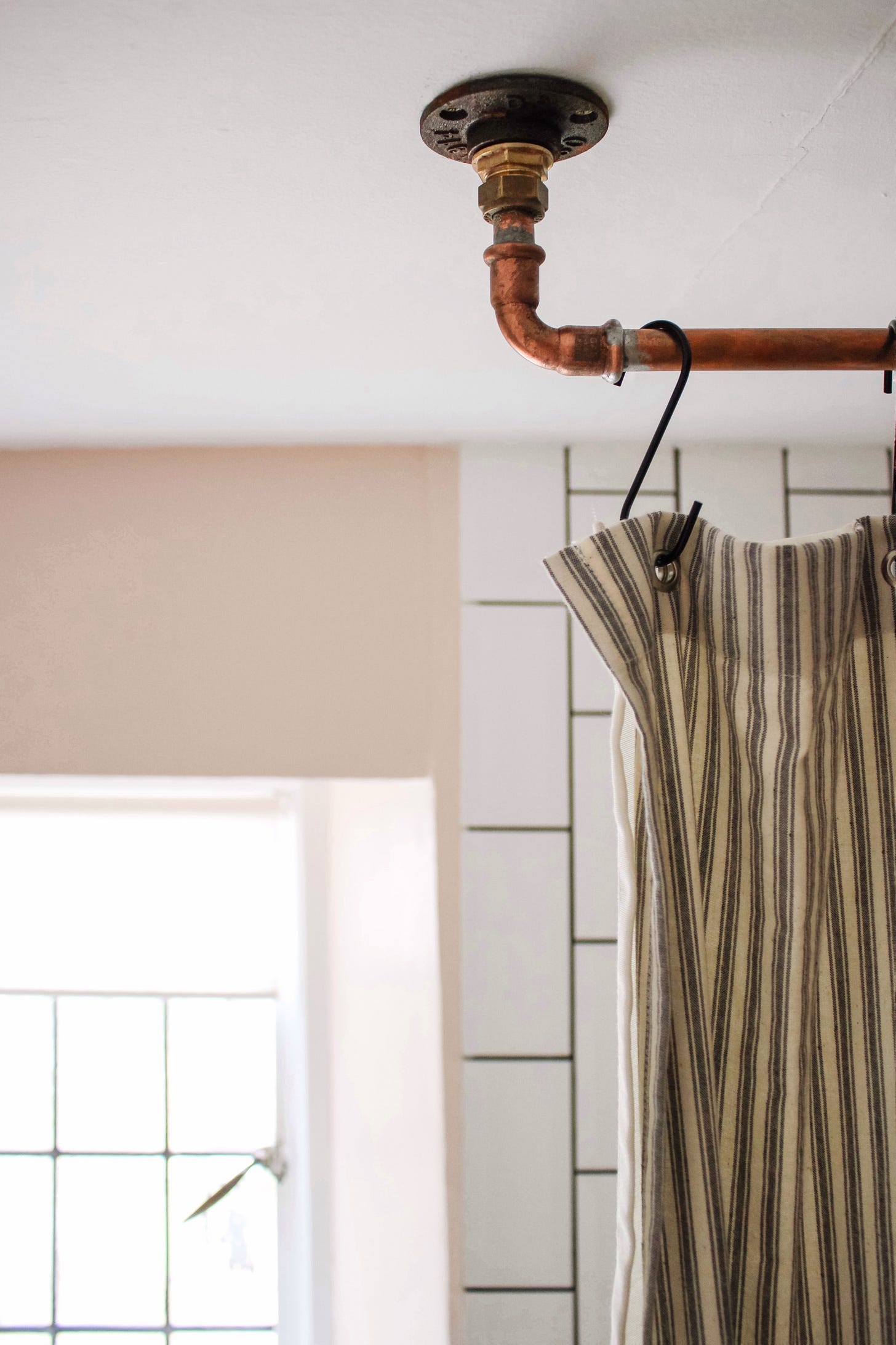 antipode.substack.com copper pipe shower curtain rail
