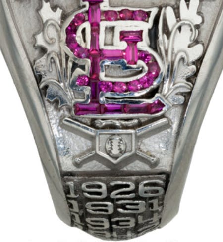 Images of the St. Louis cardinal and Rally Squirrel on the 2011 World Series Ring