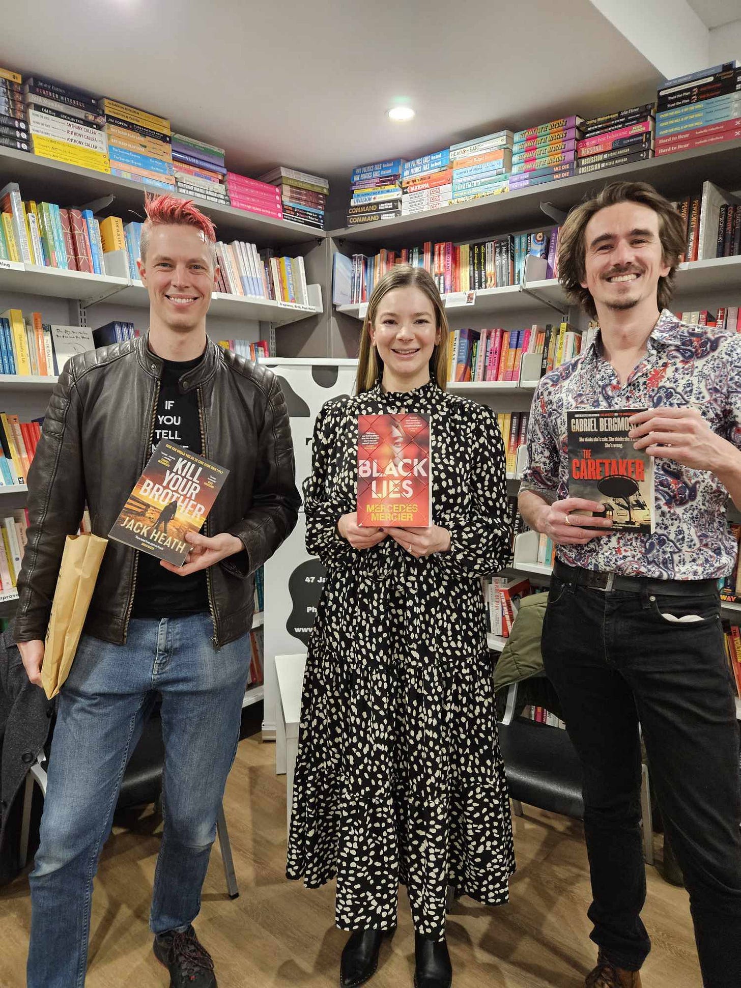 May be an image of 3 people, newsagent and text