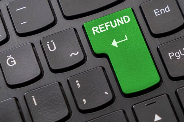 Green "refund" key on the black computer keyboard. Enter key replaced with green "refund" key on the black computer keyboard. refund stock pictures, royalty-free photos & images