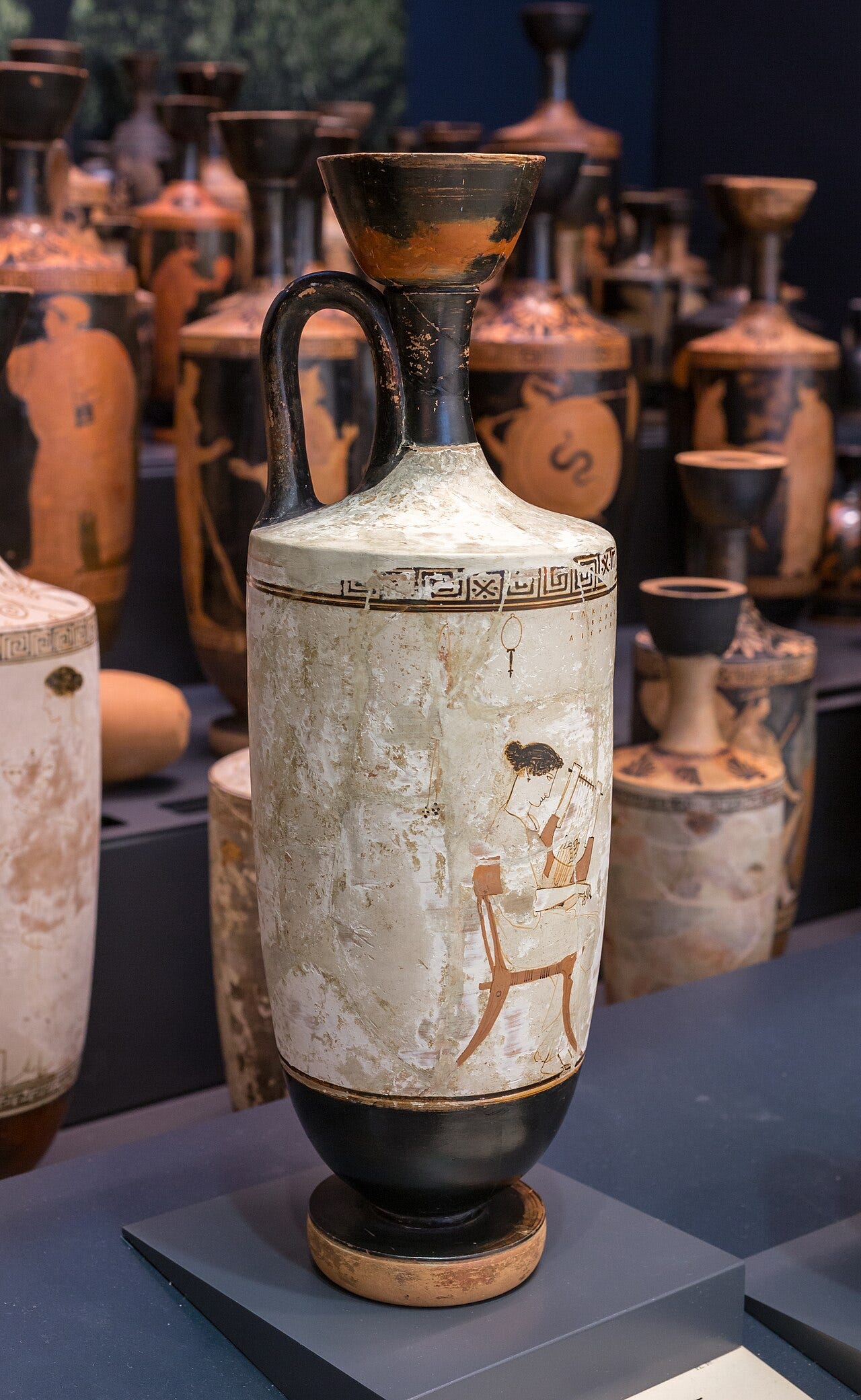 singing the Homeric epics — Attic white-ground lekythos by the Achilles Painter, woman with a phorminx, Ashmolean Museum / photo ArchaiOptix, CC BY-SA 4.0 (Wikimedia Commons)