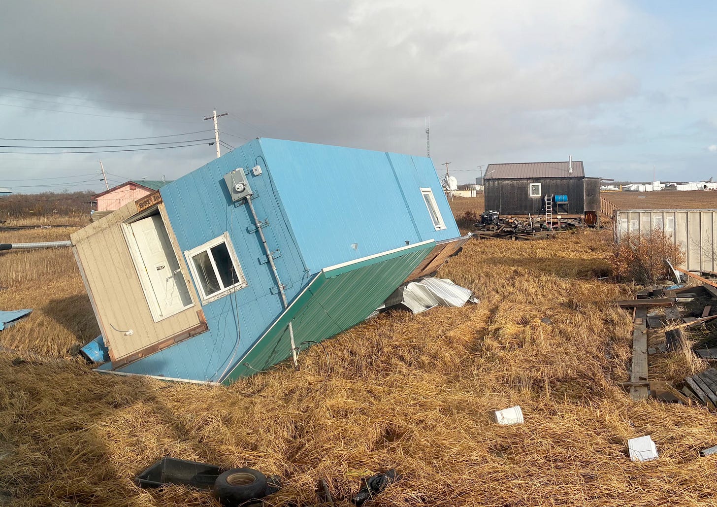 House overturned on its roof, Kotlik, Alaska