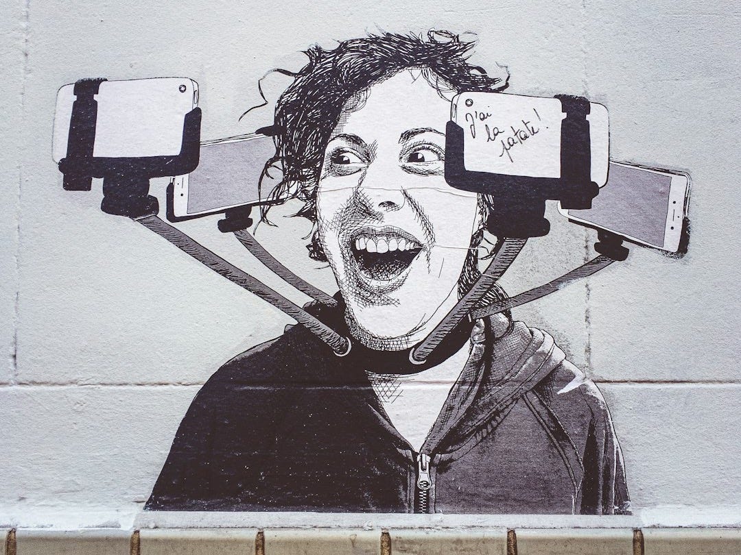 man in black leather jacket drawing