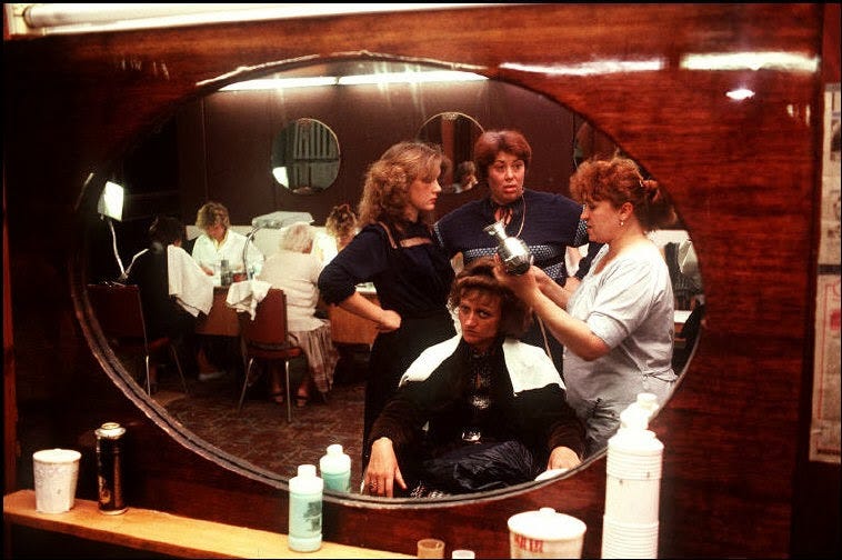 Inside a bustling salon in Odessa, reflecting everyday routines and social interactions. Inside a bustling salon in Odessa, reflecting everyday routines and social interactions.